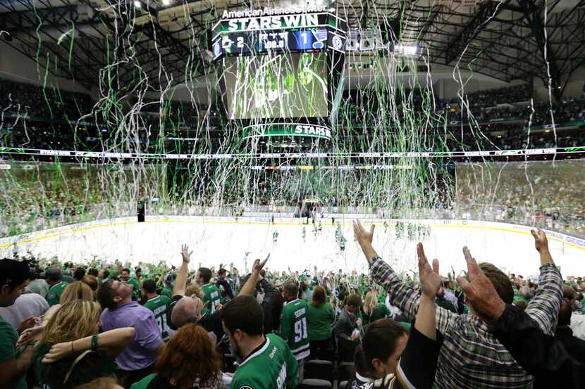 Streamers fall from the rafters as Dallas Stars fans celebrate their team's 2-1 victory over...