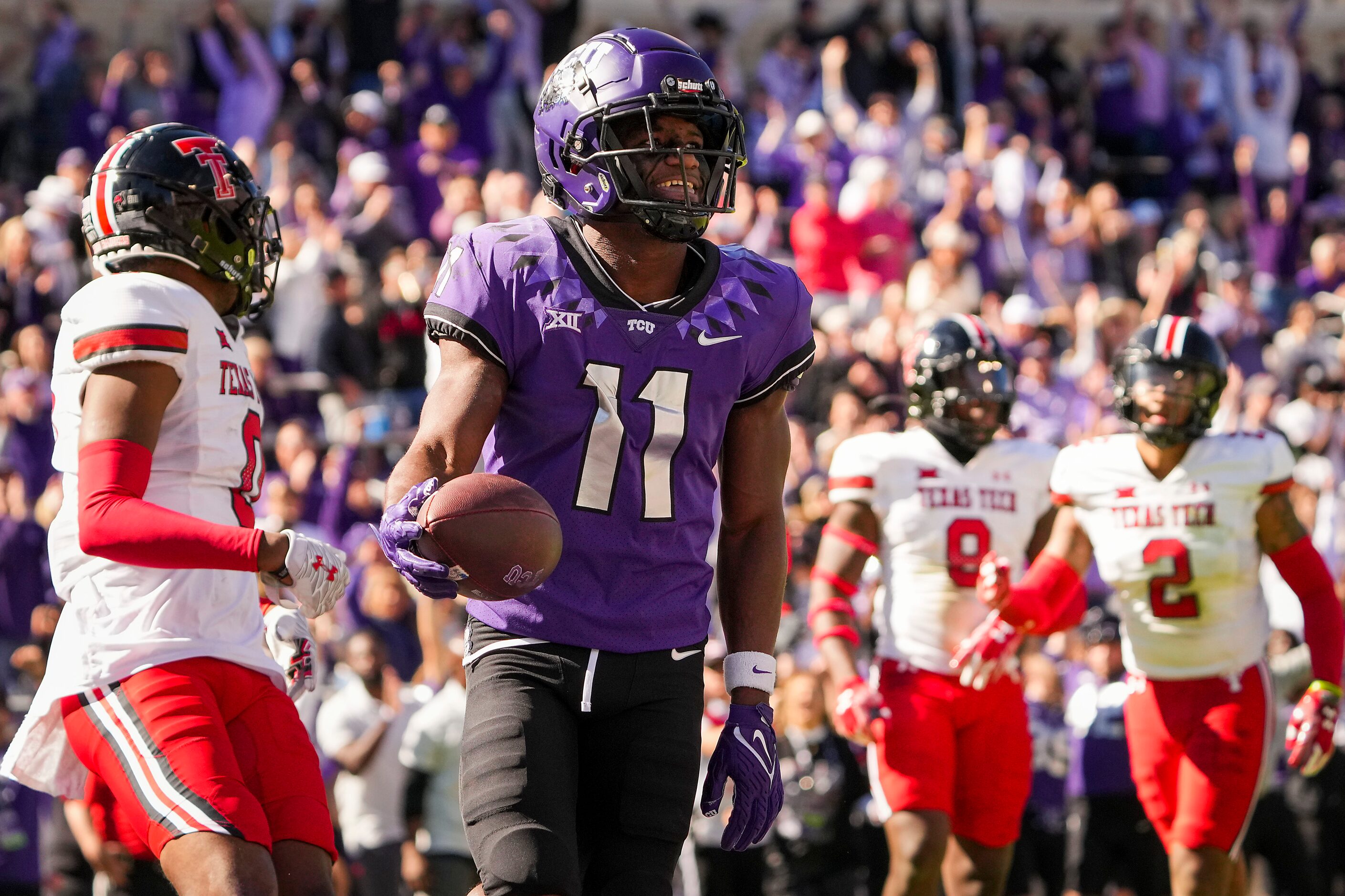 TCU wide receiver Derius Davis (11) celebrates after catching a touchdown pass during the...