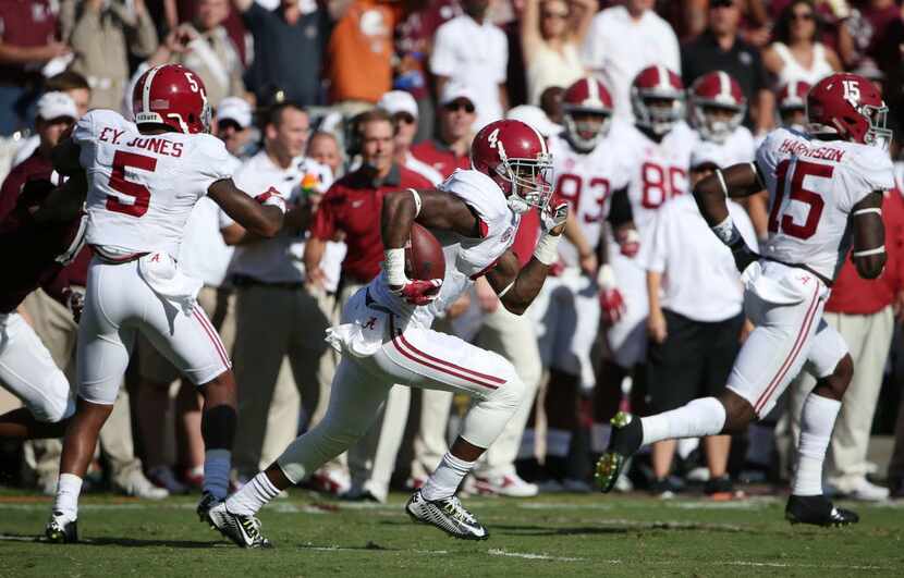 Alabama Crimson Tide defensive back Eddie Jackson (4) runs an interception for a touchdown...