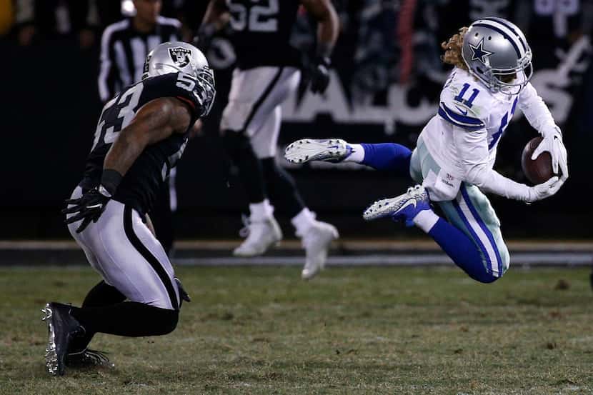 Dallas Cowboys wide receiver Cole Beasley (11) makes a catch against Oakland Raiders middle...