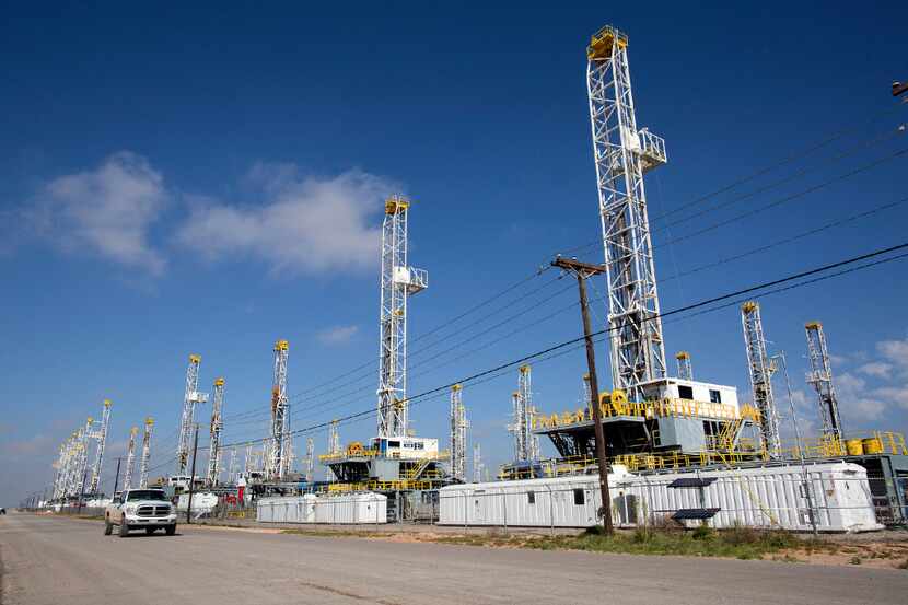 In this May 18, 2015, file photo, more than 30 oil drilling rigs stood idle in Odessa,...