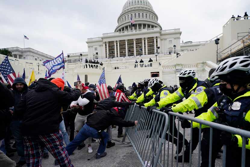 Insurrectionists loyal to former President Donald Trump tried to break through a police...