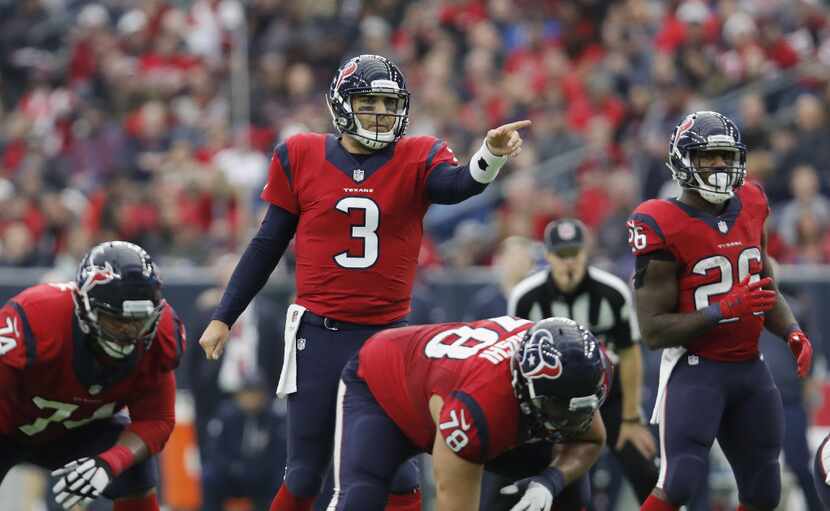 HOUSTON, TX - DECEMBER 18:  Tom Savage #3 of the Houston Texans signals at the line of...