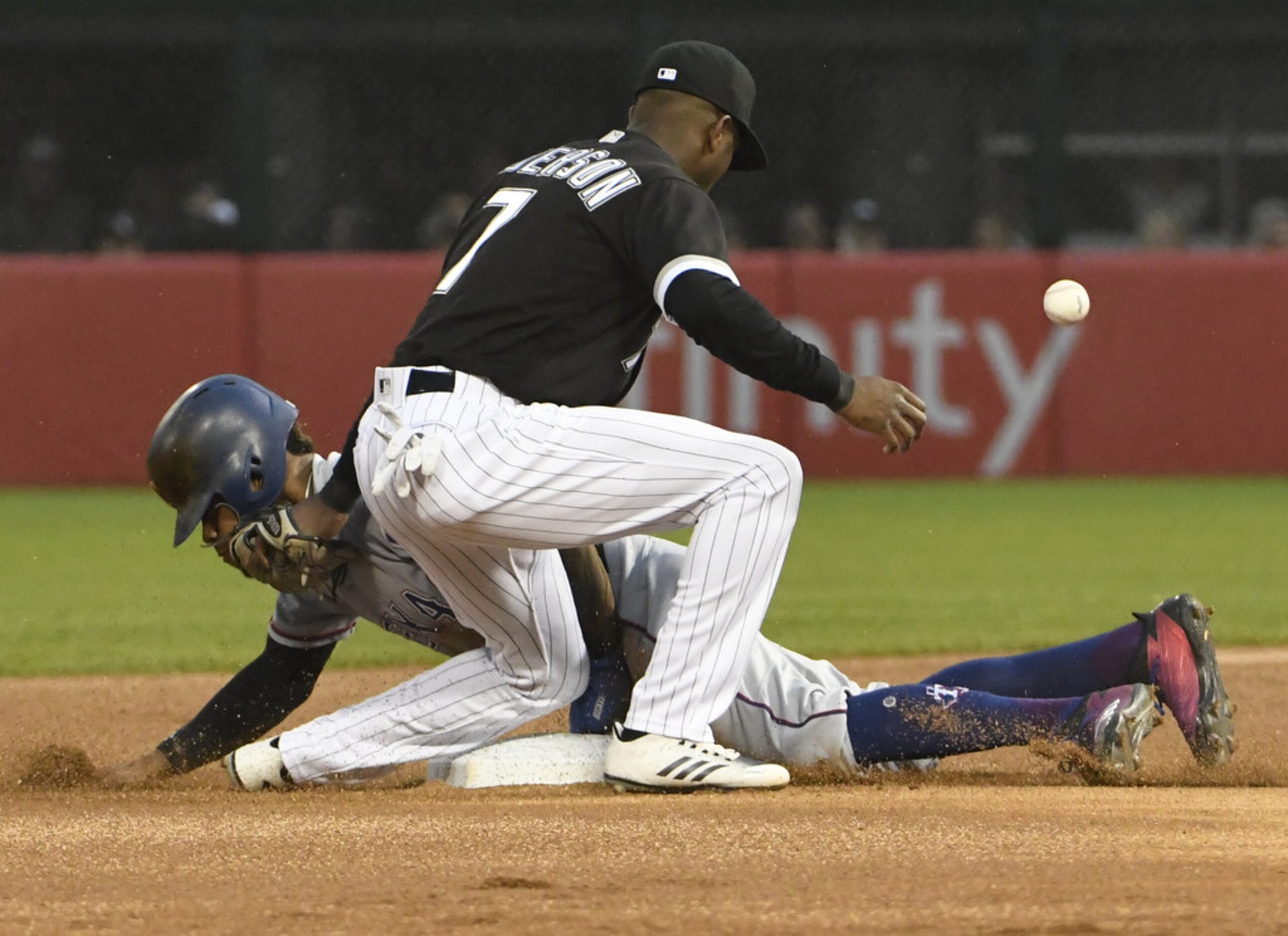 CHICAGO, IL - MAY 18: Delino DeShields #3 of the Texas Rangers steals second base as Tim...