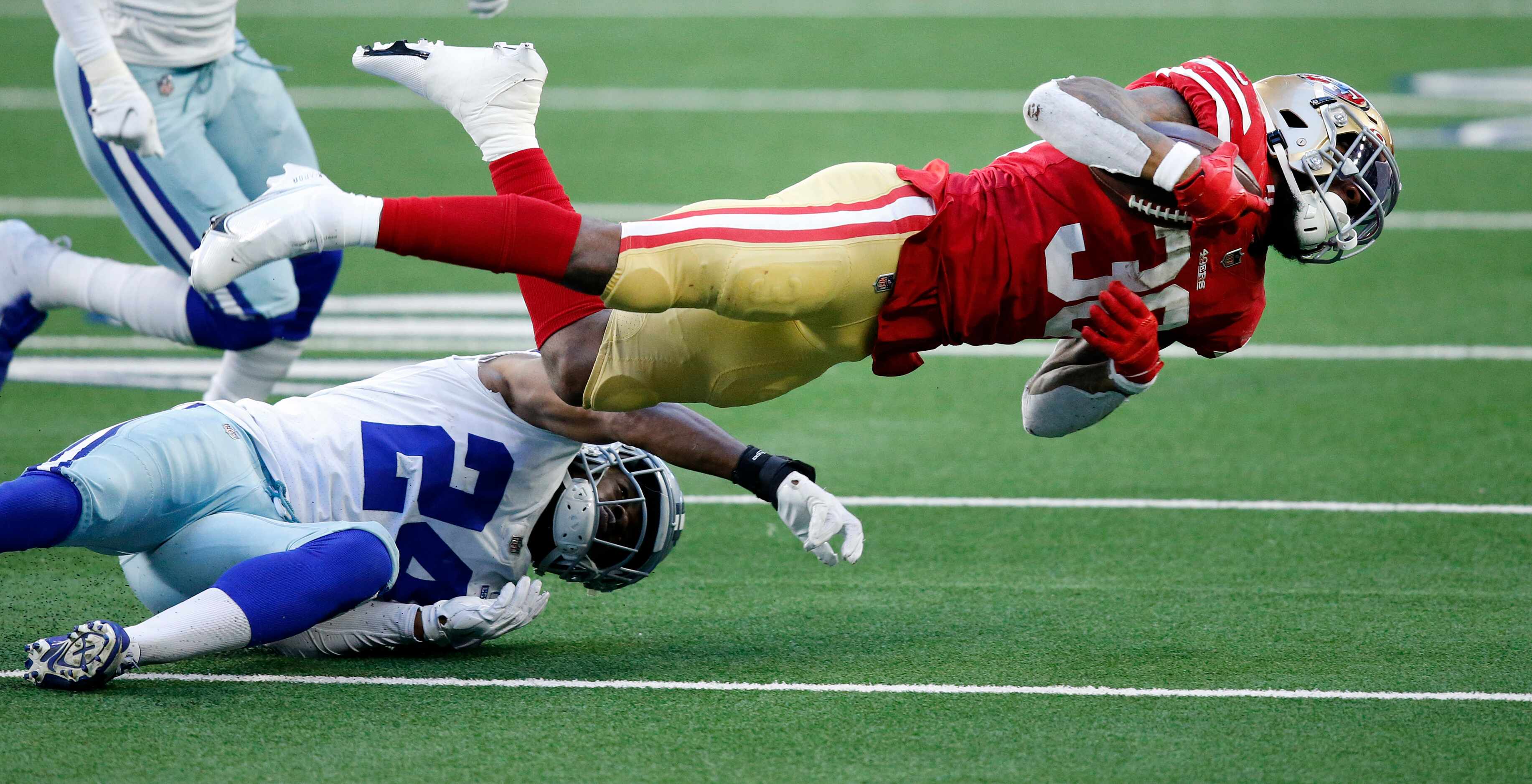 Dallas Cowboys cornerback Chidobe Awuzie (24) throws San Francisco 49ers running back Jeff...