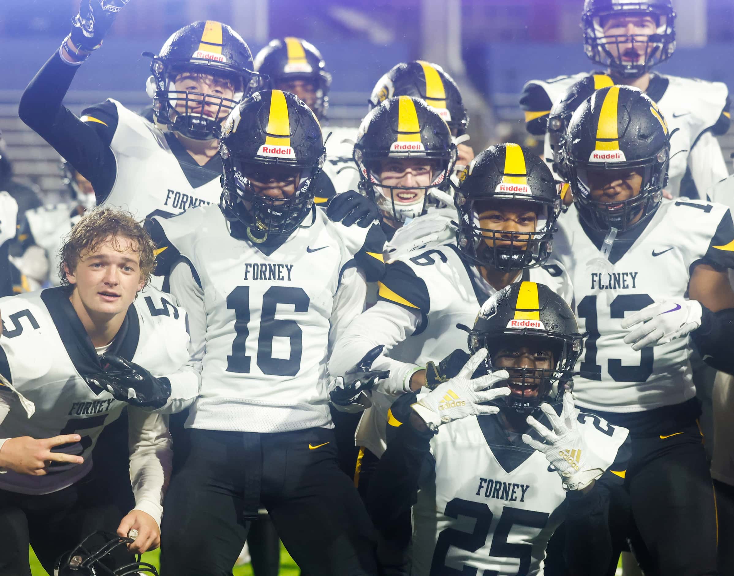 Forney players pose for a photo after their win against McKinney North at the McKinney ISD...
