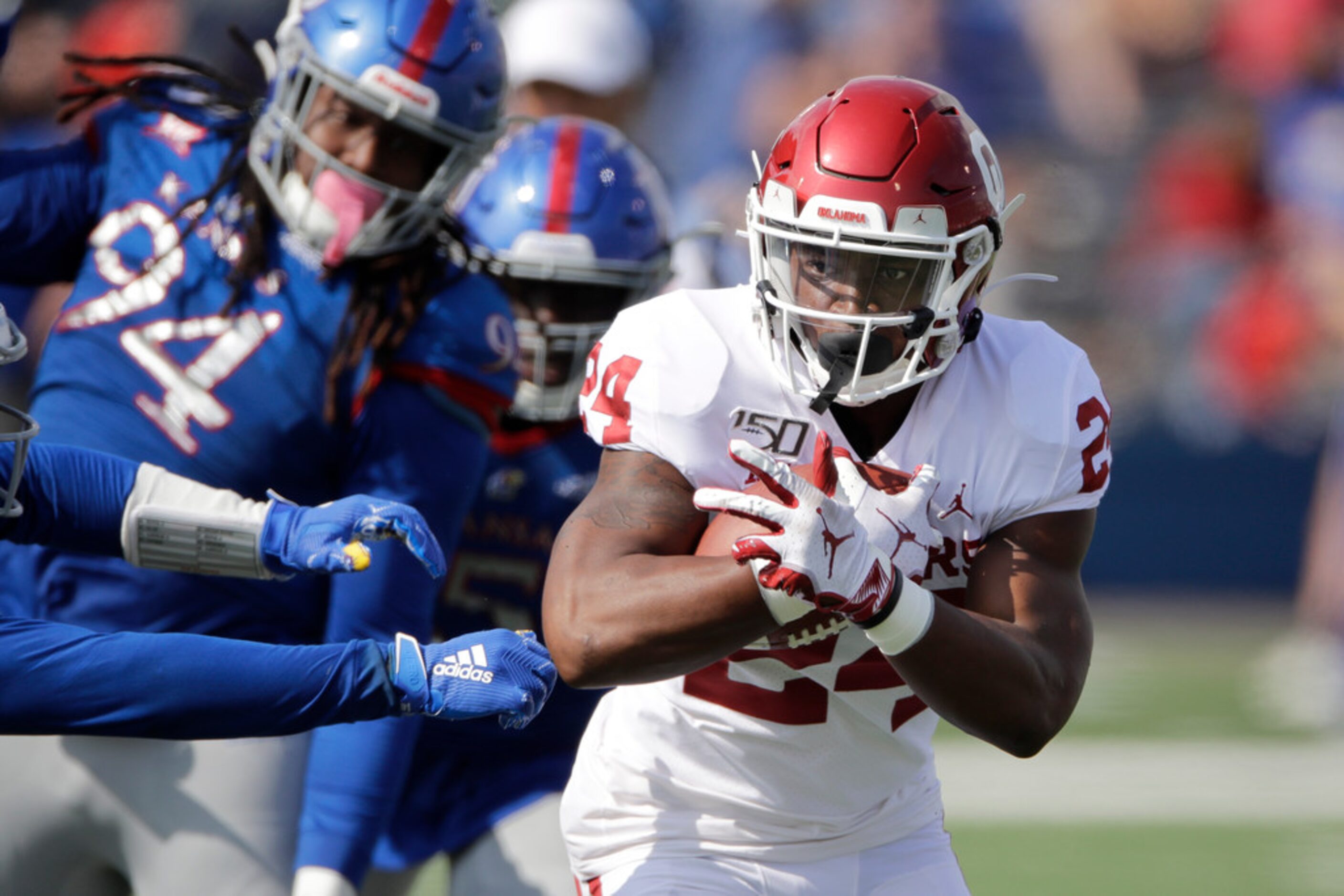 Oklahoma running back Marcus Major (24) runs the ball during the second half of an NCAA...