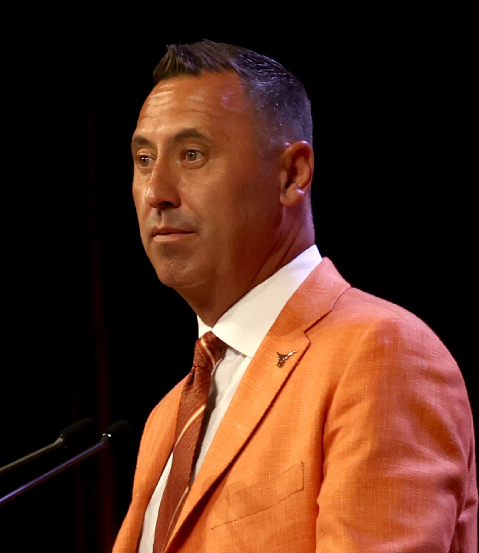 Texas Longhorns head football coach Steve Sarkisian listens intently to a question from a...