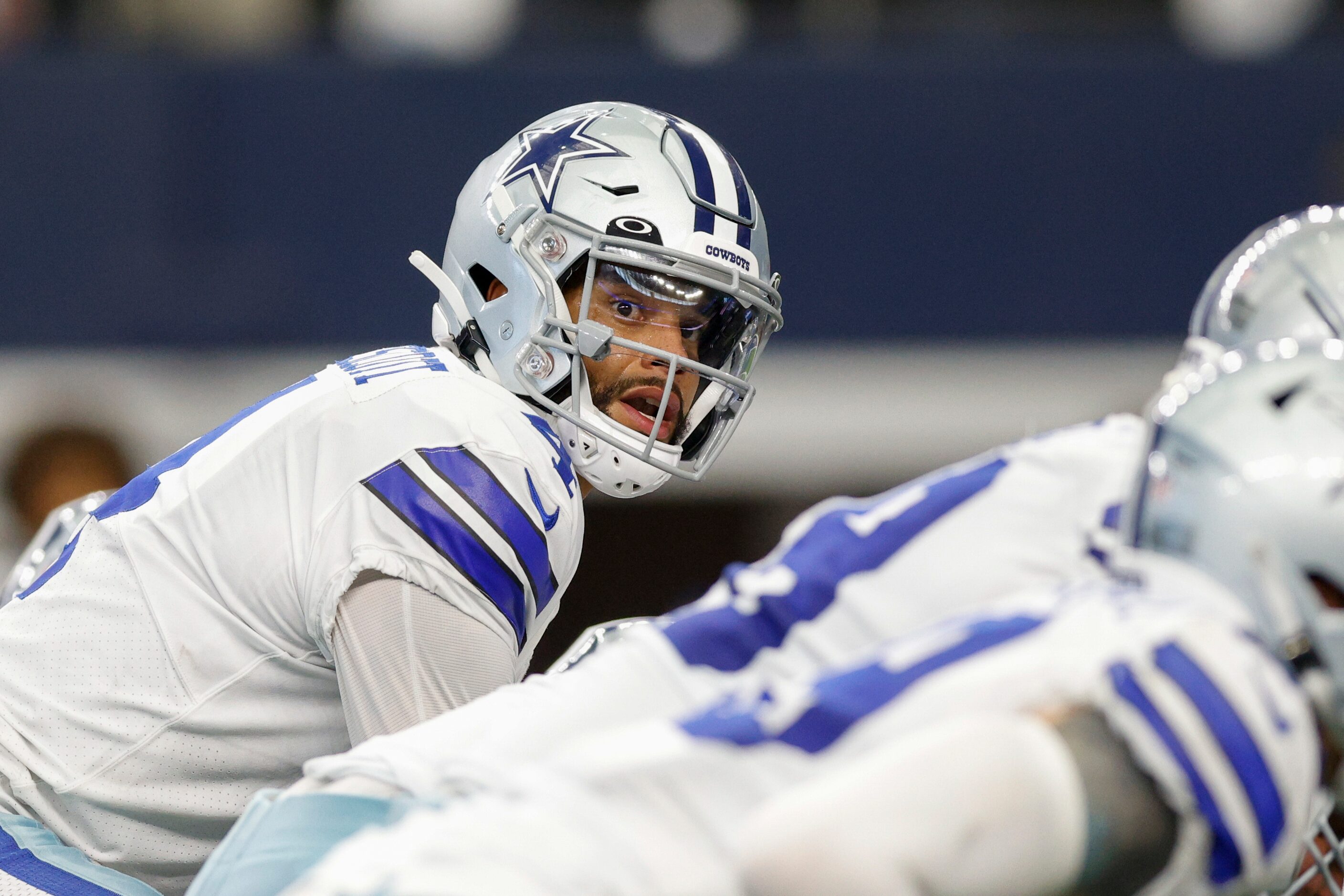 Dallas Cowboys quarterback Dak Prescott (4) looks to the sideline while under center during...