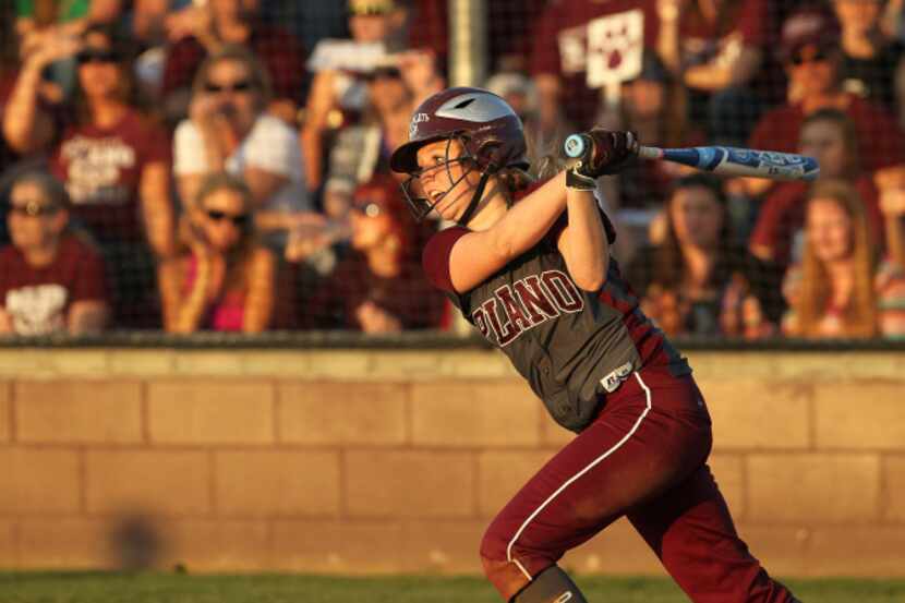 Plano Wildcats' Kali Bolter (11) follows through on a hit in the third inning of Bi-District...