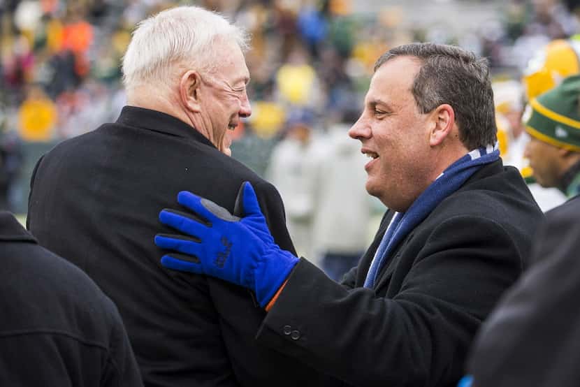 New Jersey Governor Chris Christie talks with Cowboys owner Jerry Jones on the sidelines...