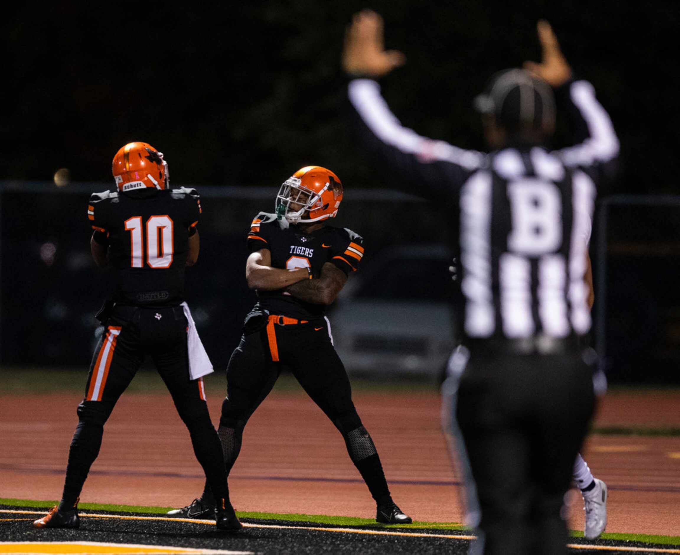 Lancaster running back Tre Bradford (2) celebrates a touchdown with wide receiver LDFair...