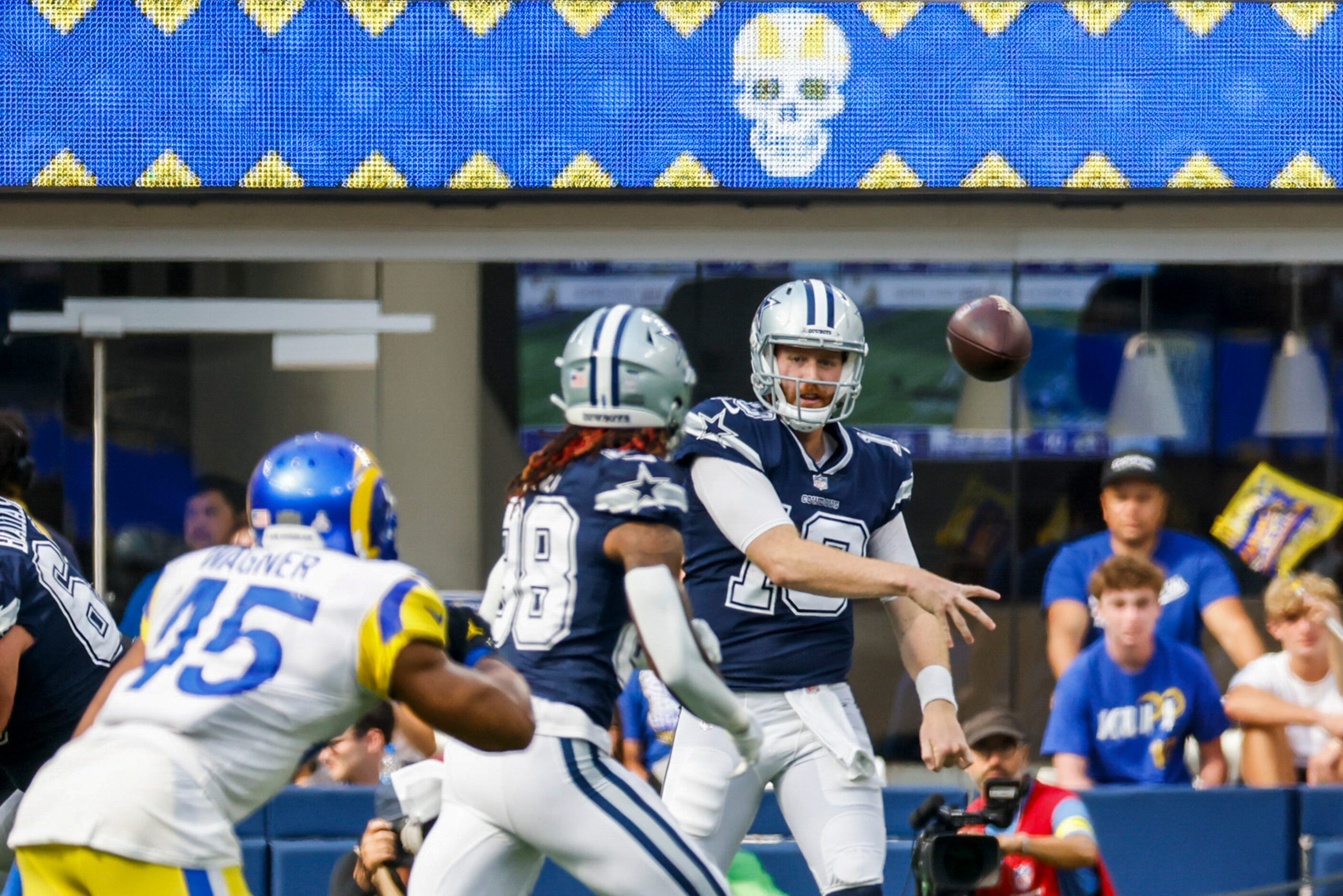 Dallas Cowboys quarterback Cooper Rush (10) throws a pass to wide receiver CeeDee Lamb (88)...