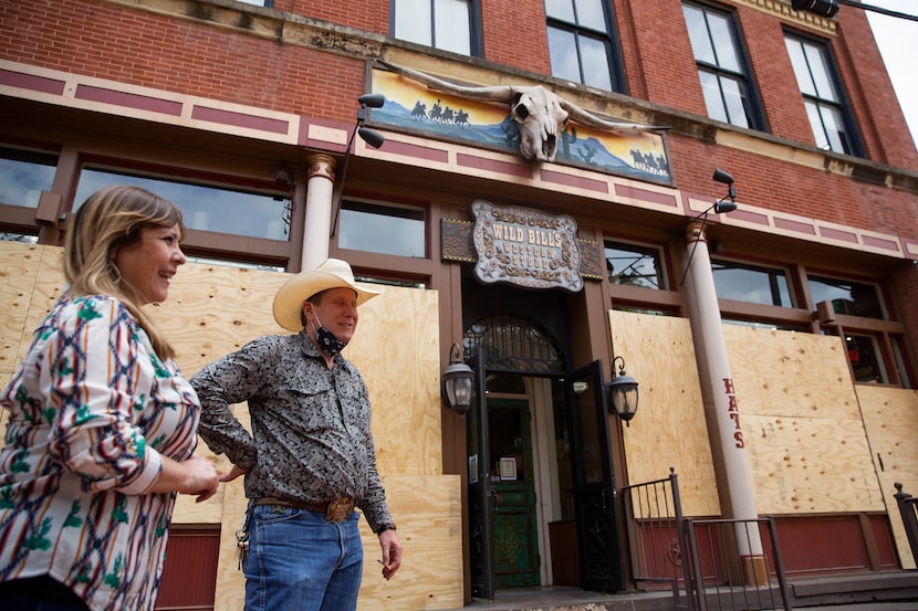 Wild Bill's Western Store managers Cynthia Meneses and Bruce Bean chatted outside the West...