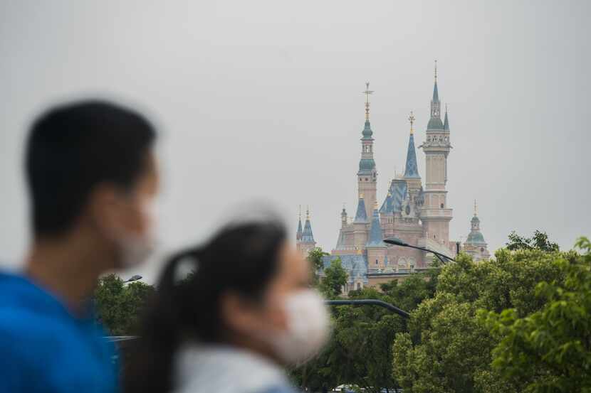 Tourists are shown at Disney town on May 05 in Shanghai, China.