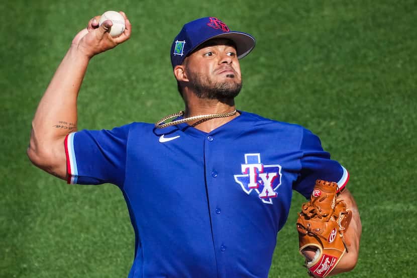 Texas Rangers pitcher Jesus Tinoco delivers during the eighth inning of a spring training...