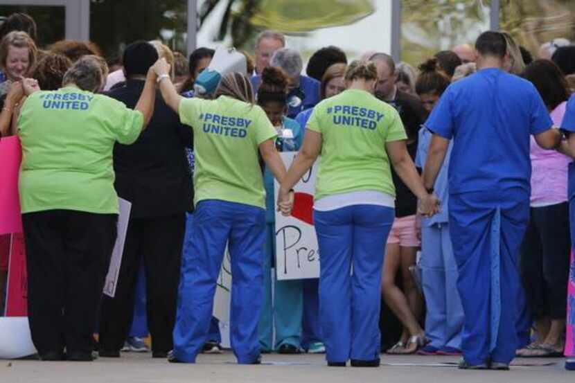 
Personnel of Texas Health Presbyterian Hospital Dallas attended a rally at the Emergency...