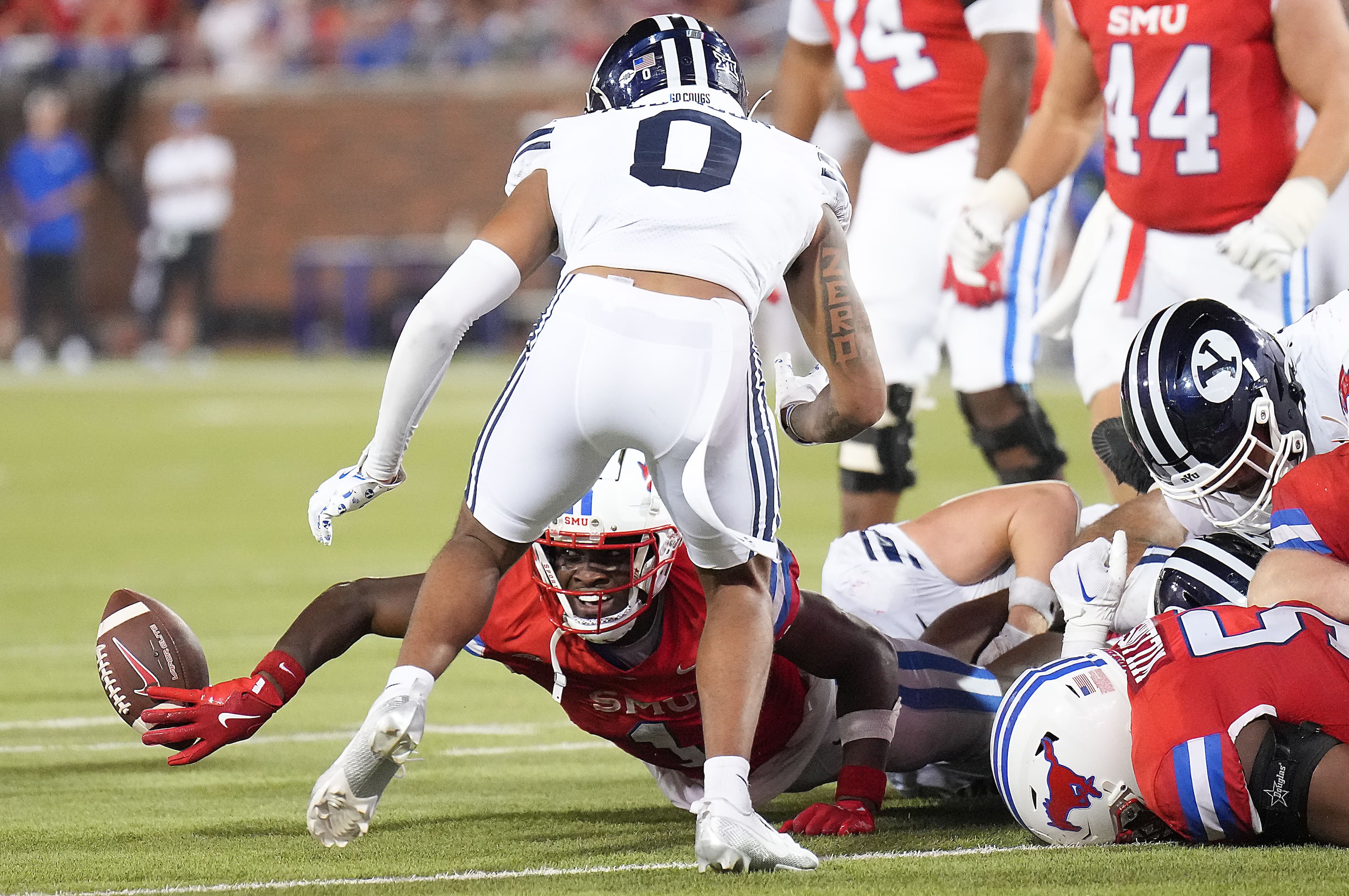 SMU running back Brashard Smith (1) fumbles the ball at the BYU eight yard line  during the...