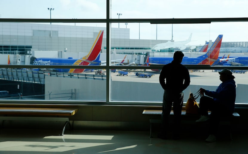 Lorenza Bowen (left) and Uyvonnie Ford wait for their flight at Dallas Love Field Airport on...