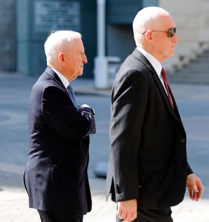 H. Ross Perot (left) arrived at the Morton H. Meyerson Symphony Center for the memorial...