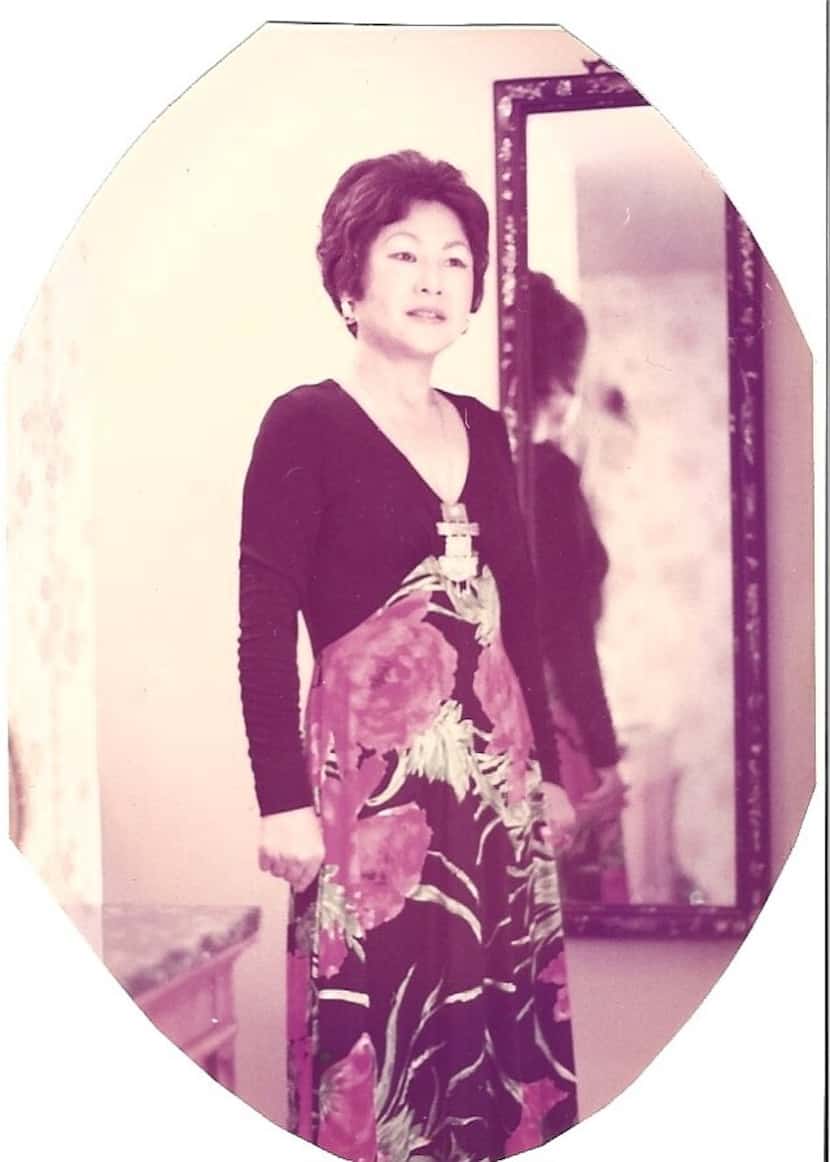 My grandmother poses while dressed to the nines as always.