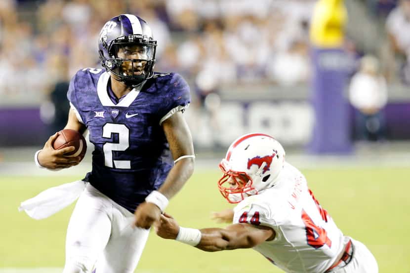 TCU Horned Frogs safety Niko Small (4) runs past Southern Methodist Mustangs linebacker...