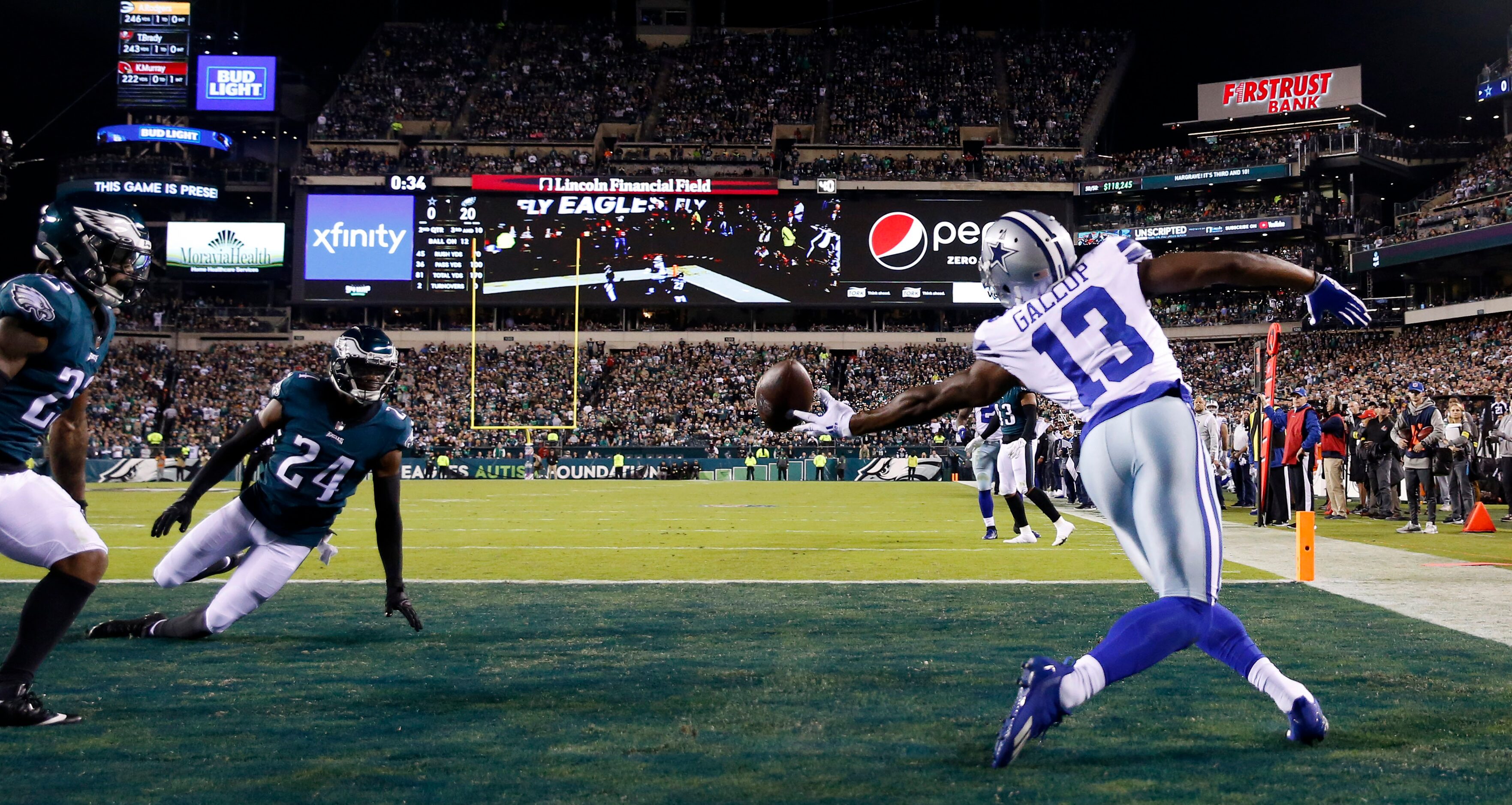 Dallas Cowboys wide receiver Michael Gallup (13) reaches back for an under thrown ball in...