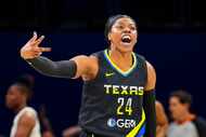 Dallas Wings guard Arike Ogunbowale (24) celebrates a basket during the first half in Game 3...