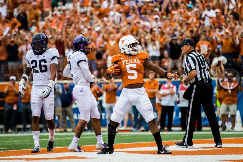 Texas Longhorns running back Tre Watson (5) celebrates a touchdown in the end zone during...