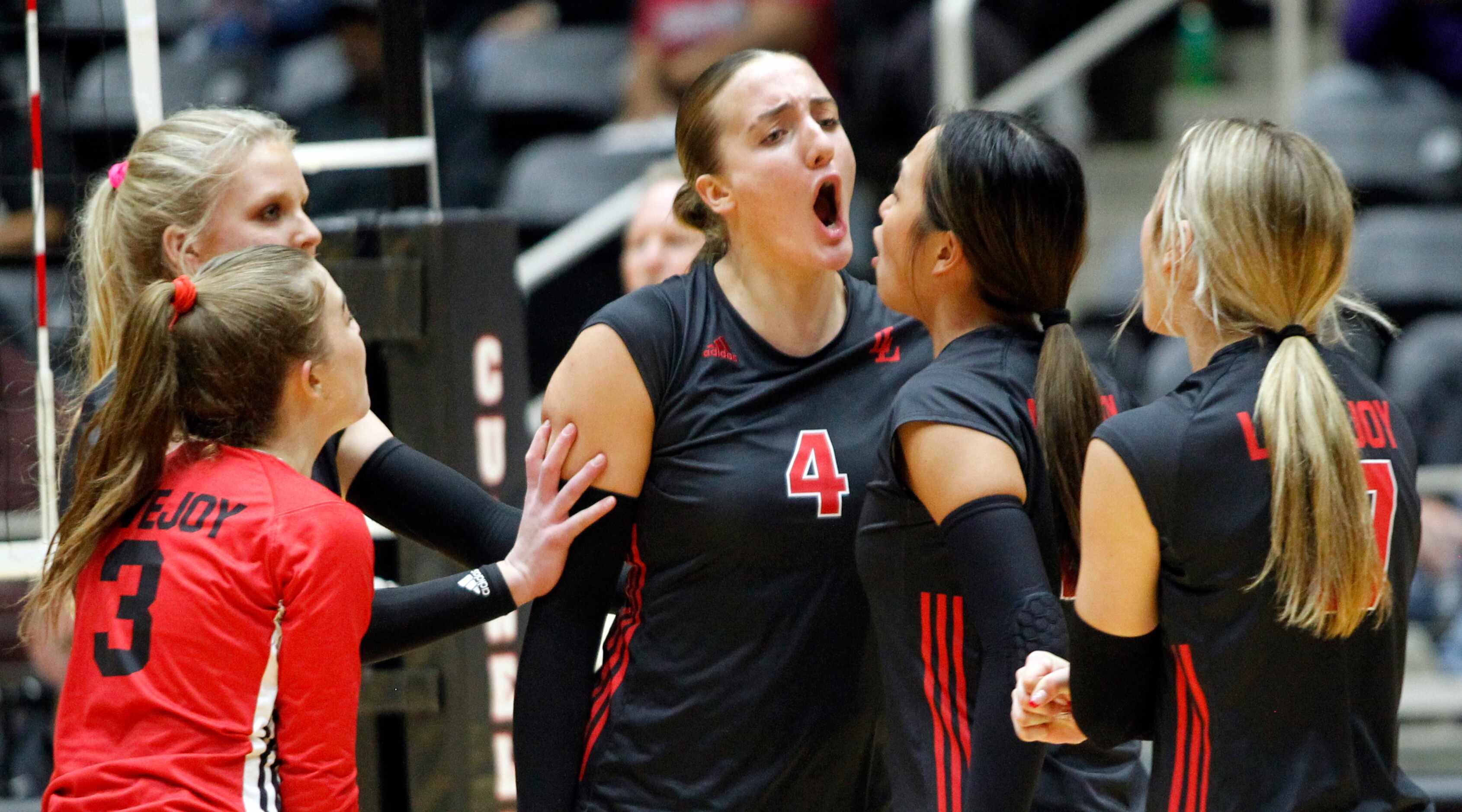 Lucas Lovejoy junior Anna Barr (4) lets out a yell as she celebrates with teammates after...