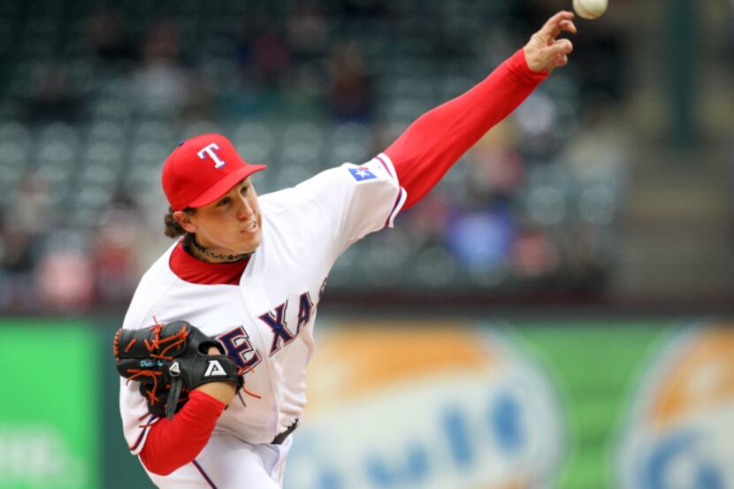 Texas Rangers starting pitcher Matt Harrison (54) pitches the ball against the Los Angeles...