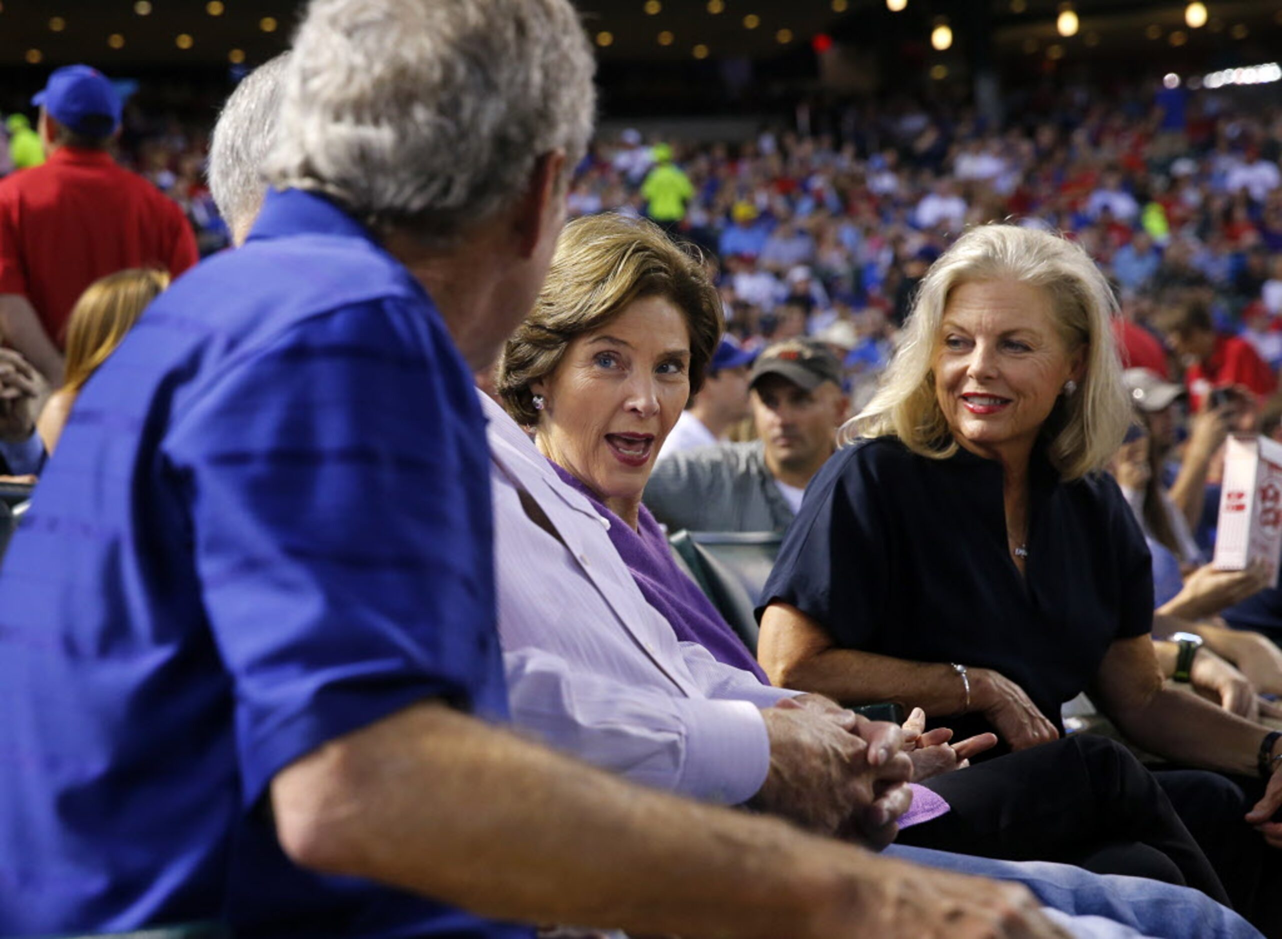 Former Texas Rangers president Nolan Ryan and his wife Ruth, right, shared the front row...