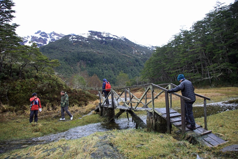 Stella Australis cruise guests enjoy a morning hike as the ship drops anchor for a few hours...