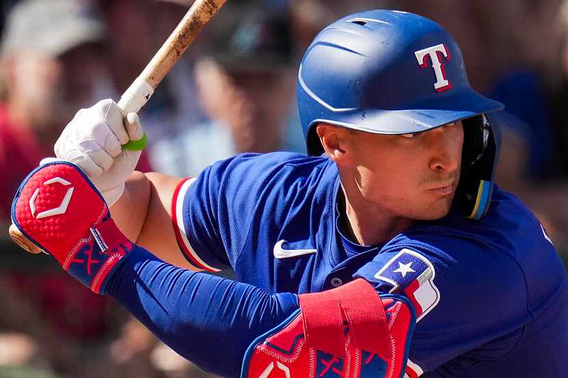 Texas Rangers infielder Justin Foscue bats during fifth inning of a spring training game...