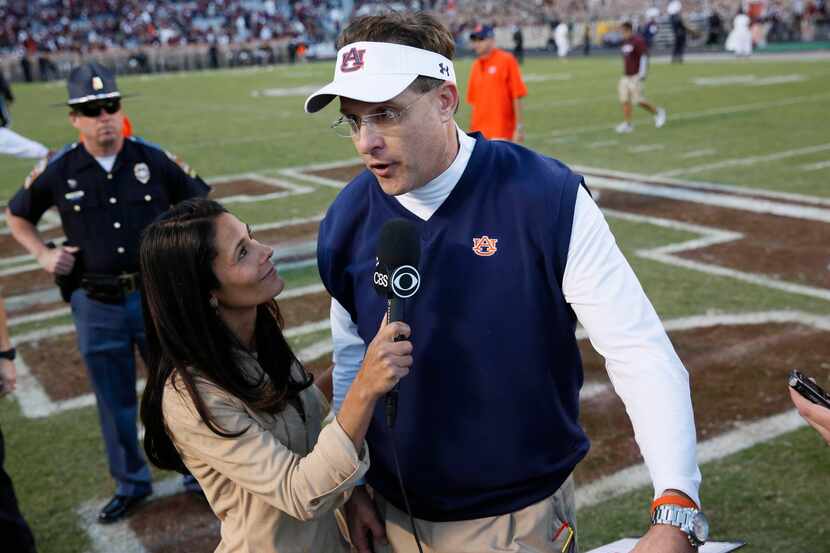 Auburn Tigers head coach Gus Malzahn is interviewed by CBS reporter Tray Wolfson after his...