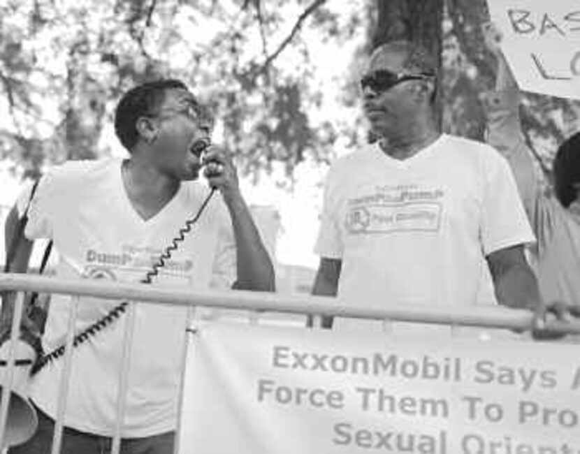  C.D. Kirven (left) and Michael Robinson were outside the Exxon Mobil shareholders meeting...