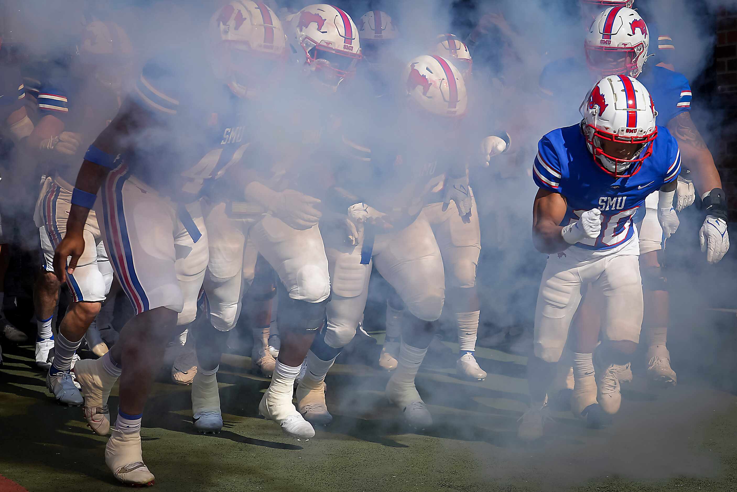 SMU players take the field to face UCF in an NCAA football game at Ford Stadium on Saturday,...