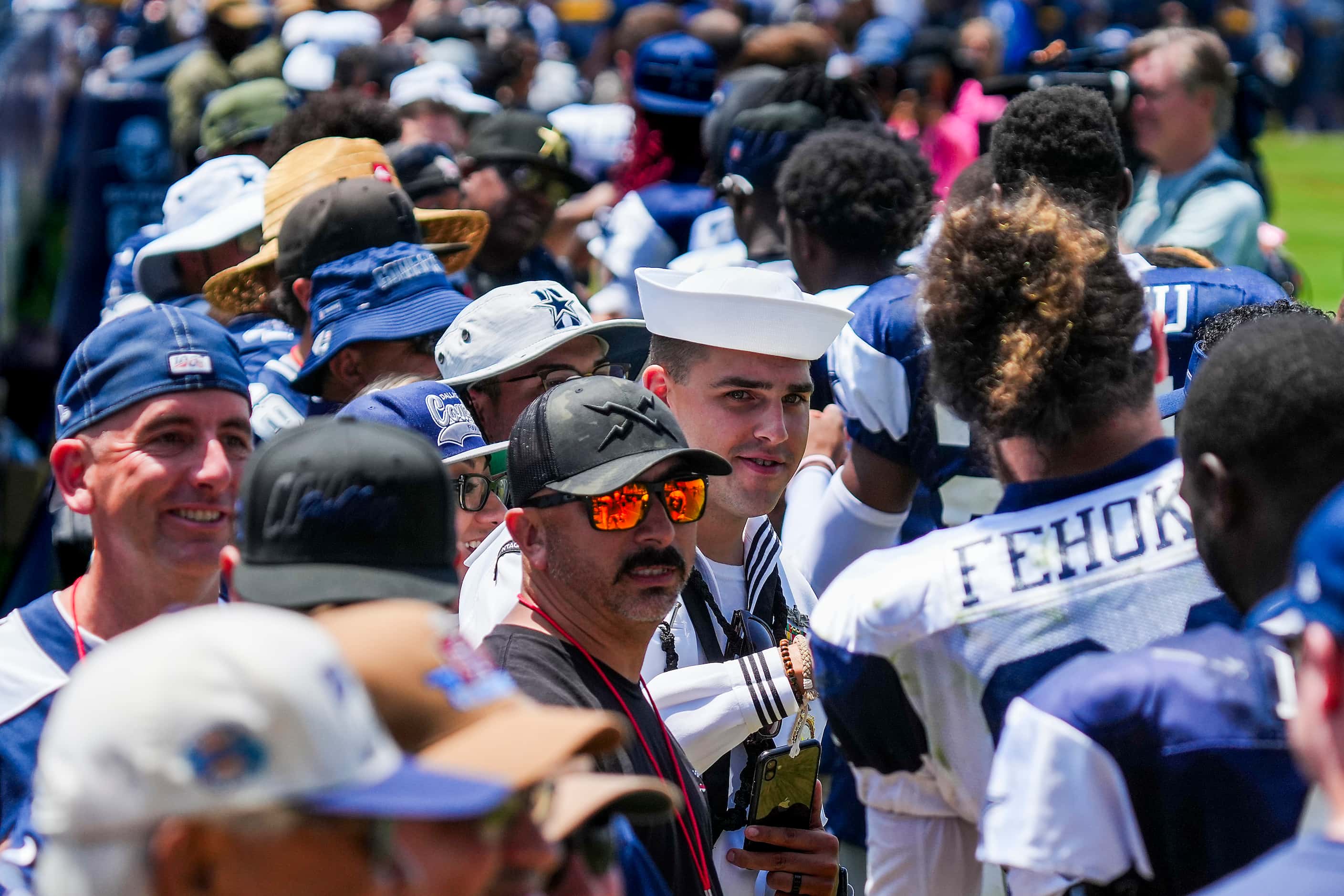 Dallas Cowboys players thank service members after a training camp practice on Monday, Aug....