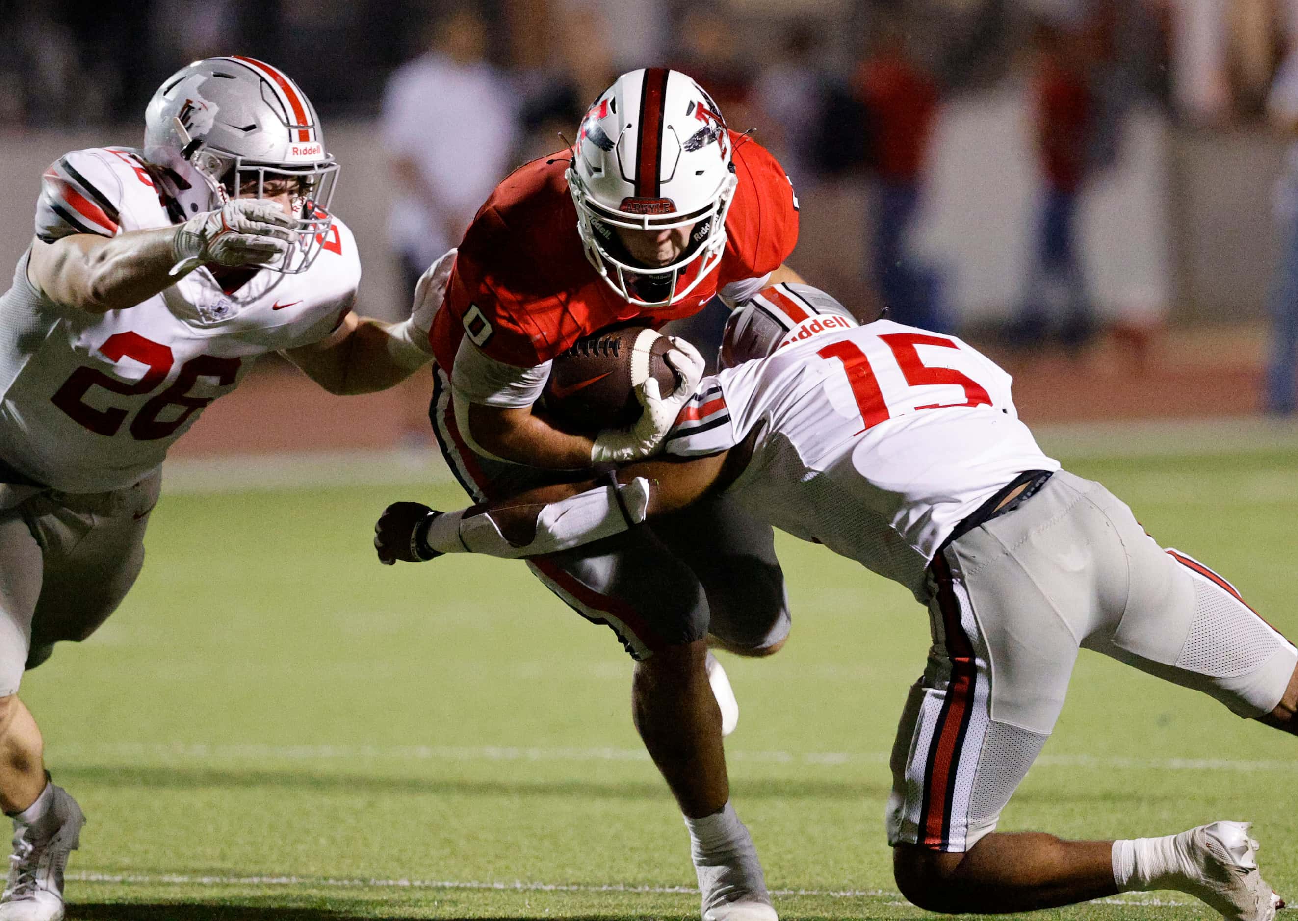 Argyle's Devon Owen (0) is tackled by Lovejoy's Aarren Marshall (15) and Lovejoy's Payton...