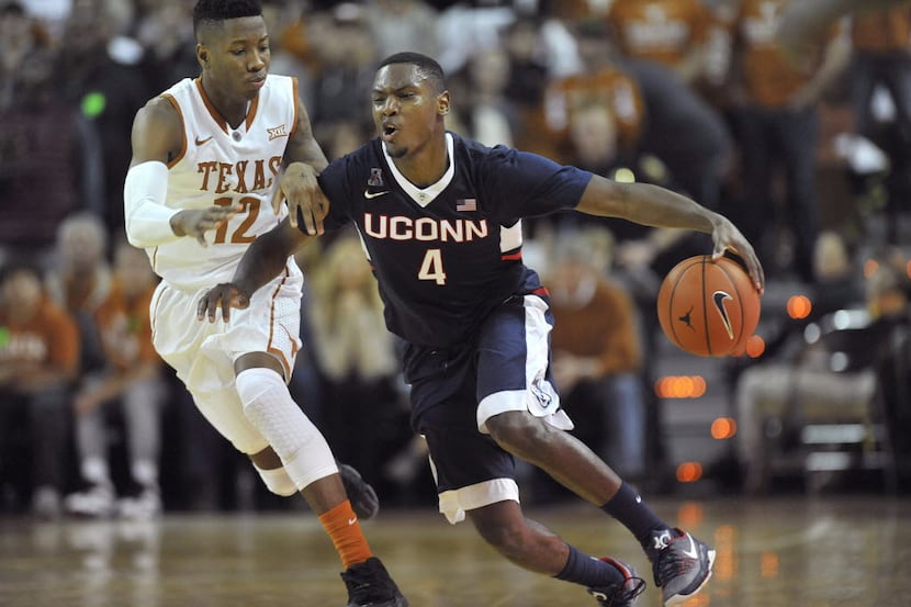 Connecticut Huskies guard Sterling Gibbs (4) is fouled by Texas Longhorns guard Kerwin Roach...