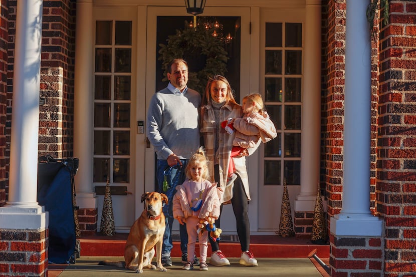 Mike and Audrey Schott with their dog, Hobie, and two daughters, Willa and Mae, in Audrey's...