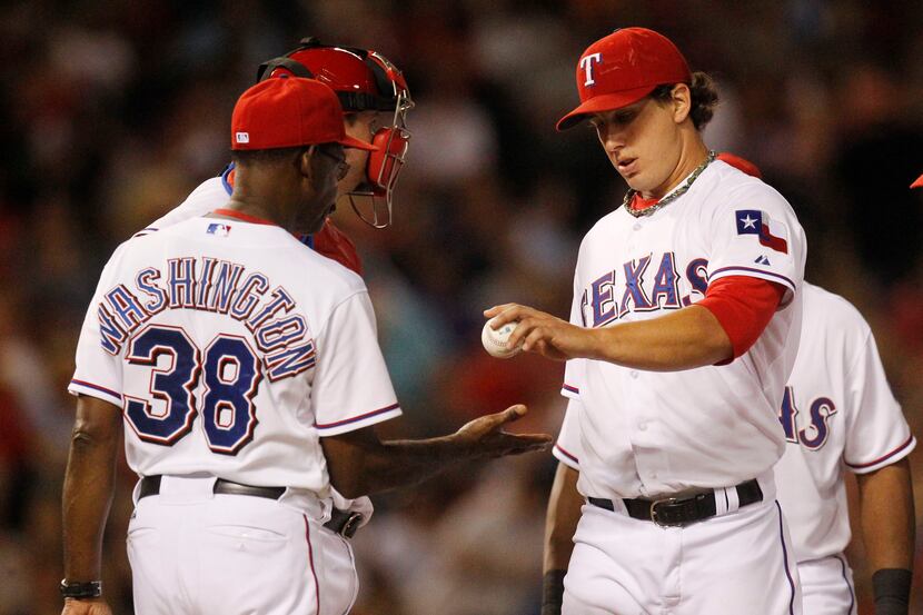 Rangers pitcher Derek Holland is pulled from Wednesday's game against Houston. (Michael...