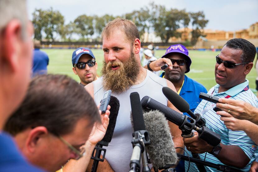 Dallas Cowboys center Travis Frederick (72) talks to reporters after a morning practice at...
