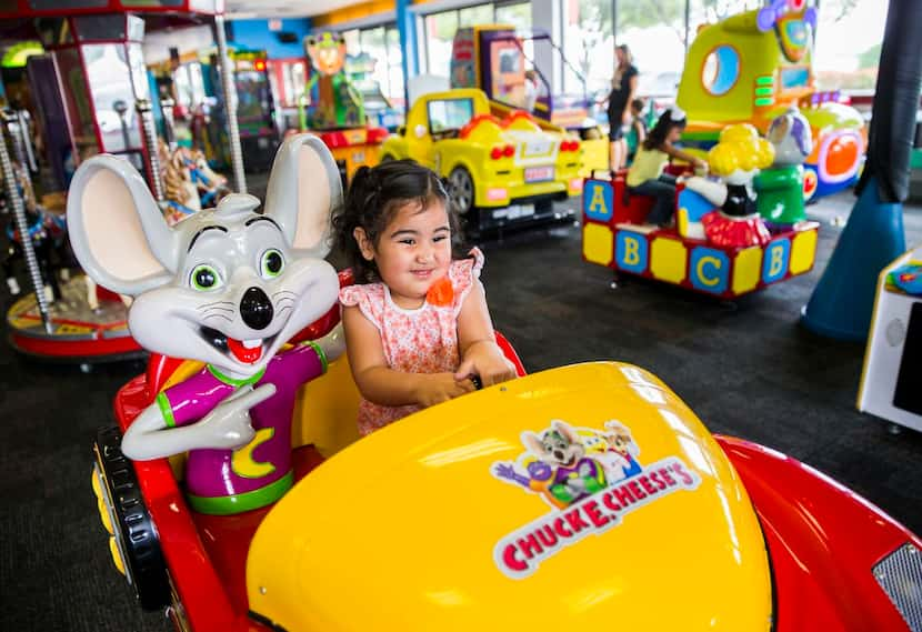 
Amaya Martinez, 3, rides a token-operated car ride at Chuck E Cheese on Wednesday, April 8,...