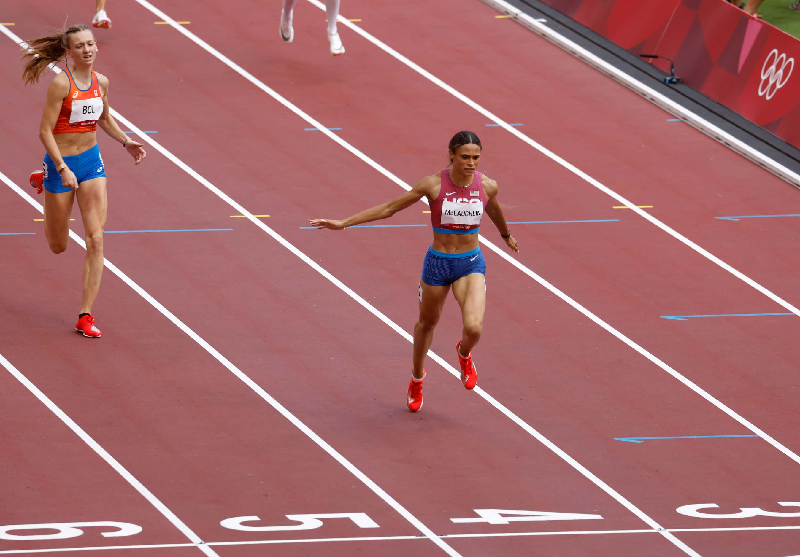 USA’s Dalilah Muhammad, Netherland’s Femke Bol, and USA’s Sydney McLaughlin clear the last...