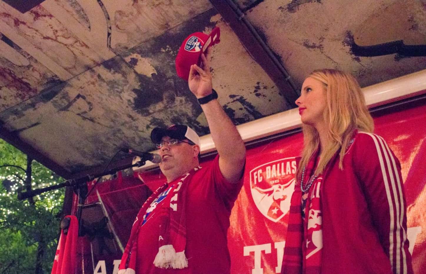 FC Dallas employees gave away hats, autographed photos and tickets to Sunday's playoff game...