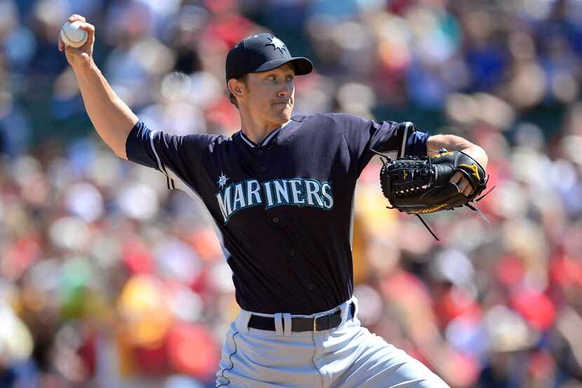 Mar 11, 2014; Tempe, AZ, USA; Seattle Mariners starting pitcher Scott Baker (58) pitches...