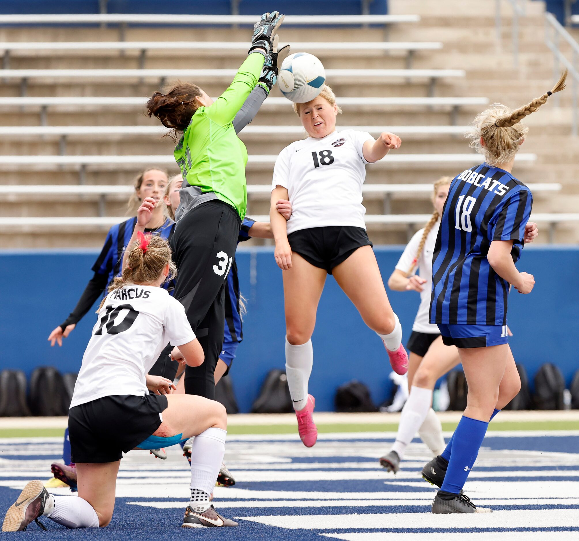 On a corner kick, Flower Mound Marcus (18) attempts to head the ball past Trophy Club Byron...