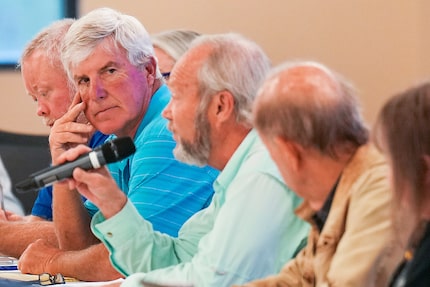 Jim Thompson, the chair of the Region D planning group, listens to Region C chair Kevin Ward...