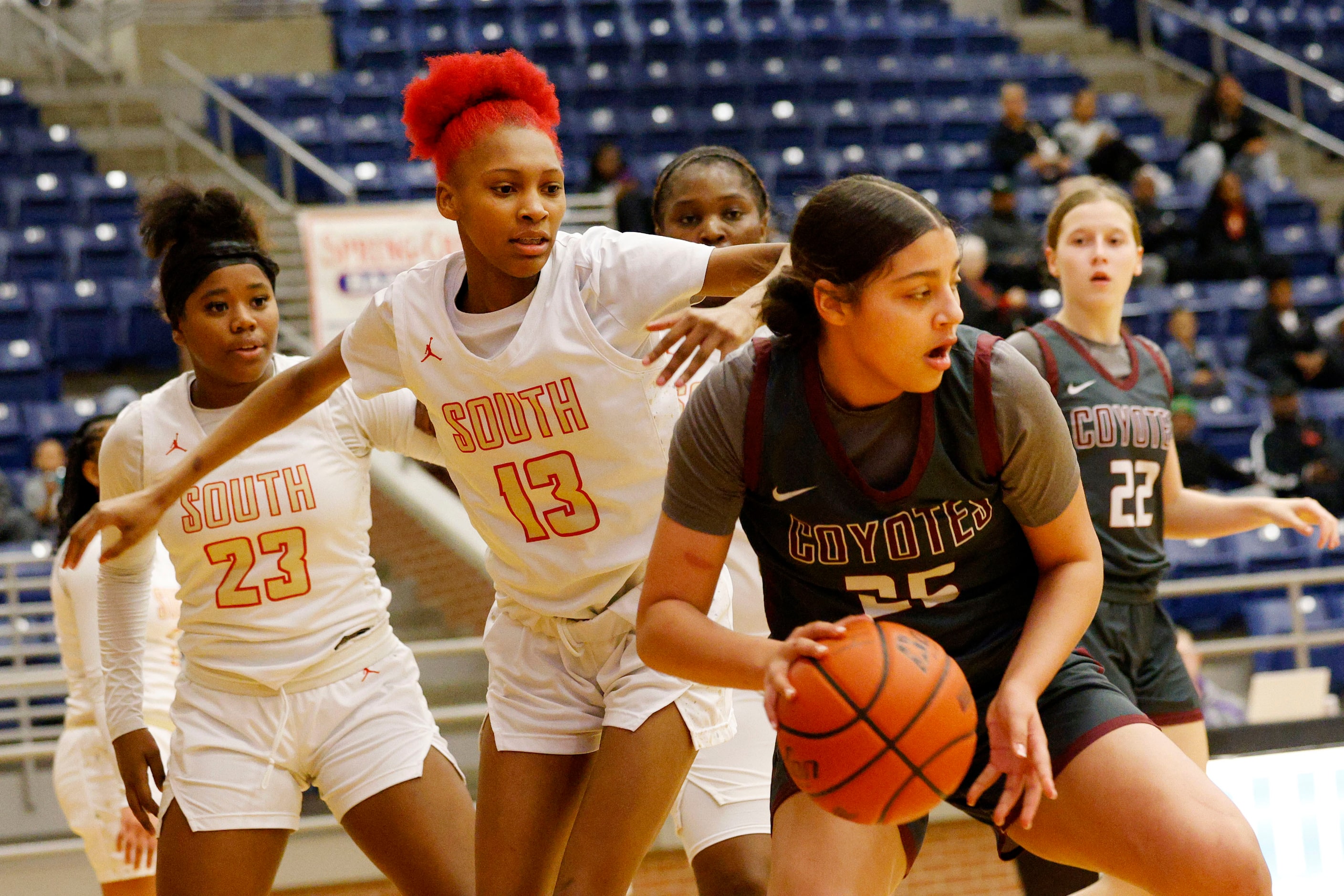 Frisco Heritage's Ella Hooper (25) keeps the ball away from South Grand Prairie's Dalashia...